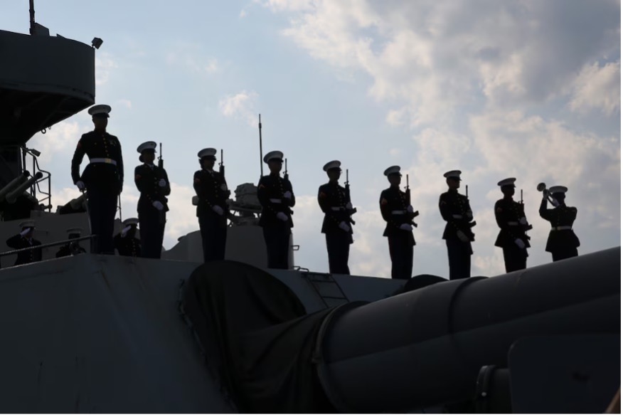 Image of Marines folding flag.